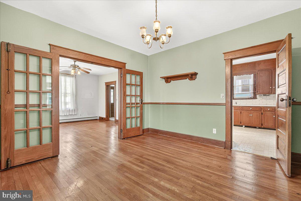 206 Prospect Street Middletown, MD 21769 - Photo 8 of 47 wooden floor in an empty room with a window
