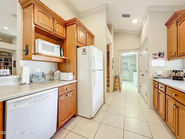 a open kitchen with stainless steel appliances granite countertop a stove and a sink