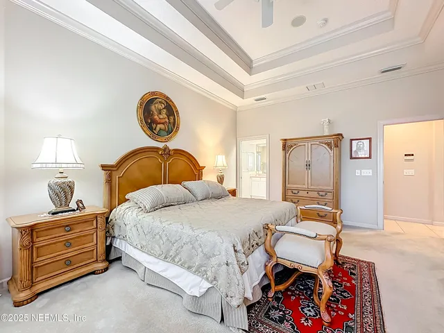 a bedroom with a bed and dresser