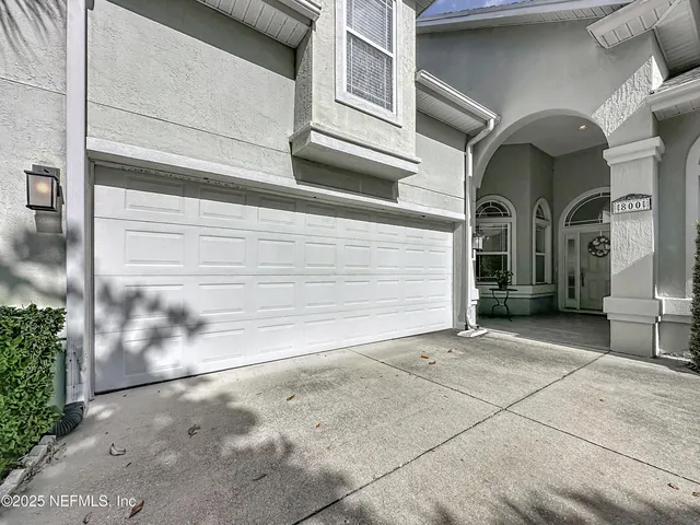 a view of a house with a garage