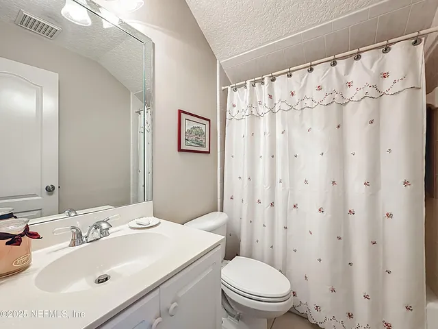 a view of storage and utility room with washer and dryer