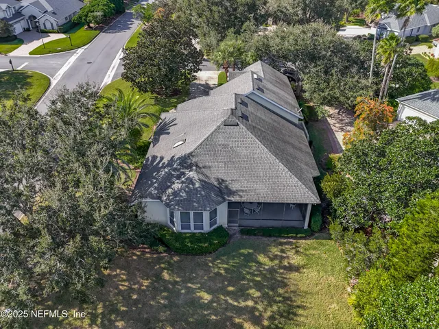 an aerial view of residential house with outdoor space and swimming pool