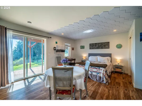 a bedroom with a bed and a painting