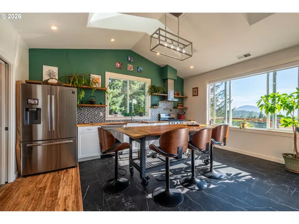a kitchen with a stove a sink and a wooden cabinets