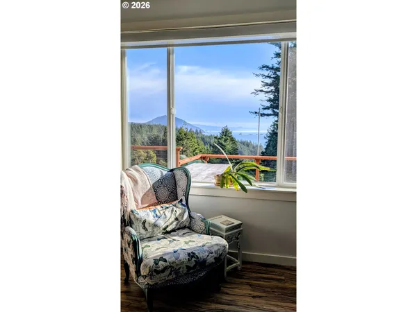 a view of a hallway with wooden shelves