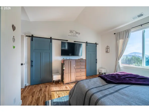 a bathroom with a tub sink and glass door