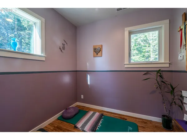 a view of a patio with table and chairs and potted plants