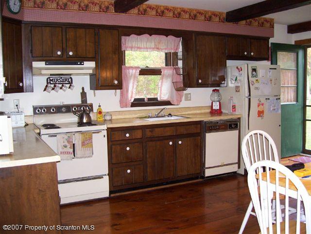 1 Rr Sugar Run Mehoopany, PA 18629 - Photo 3 of 5 a kitchen with stainless steel appliances a sink a stove a refrigerator and cabinets