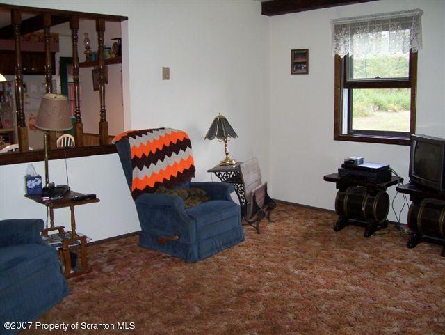 1 Rr Sugar Run Mehoopany, PA 18629 - Photo 4 of 5 a living room with furniture a window and gym equipment