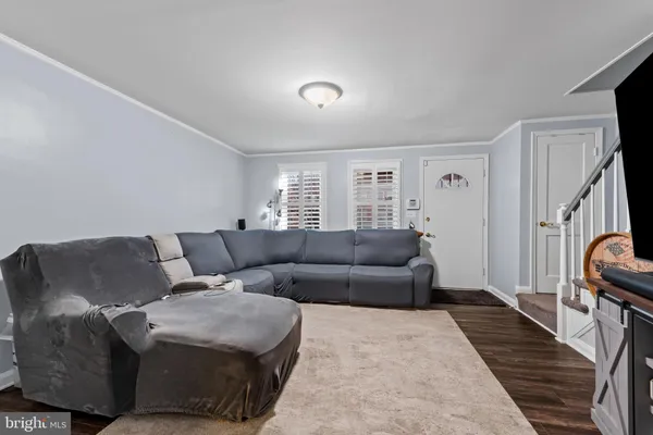 a living room with furniture and a rug