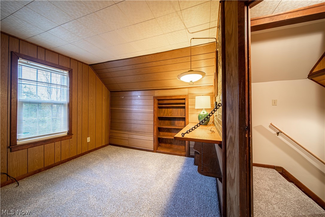 4639 Webb Road Perry, OH 44081 - Photo 17 of 34 1st of the 2nd floor bedrooms, with built-ins and paneled walls. New carpet!