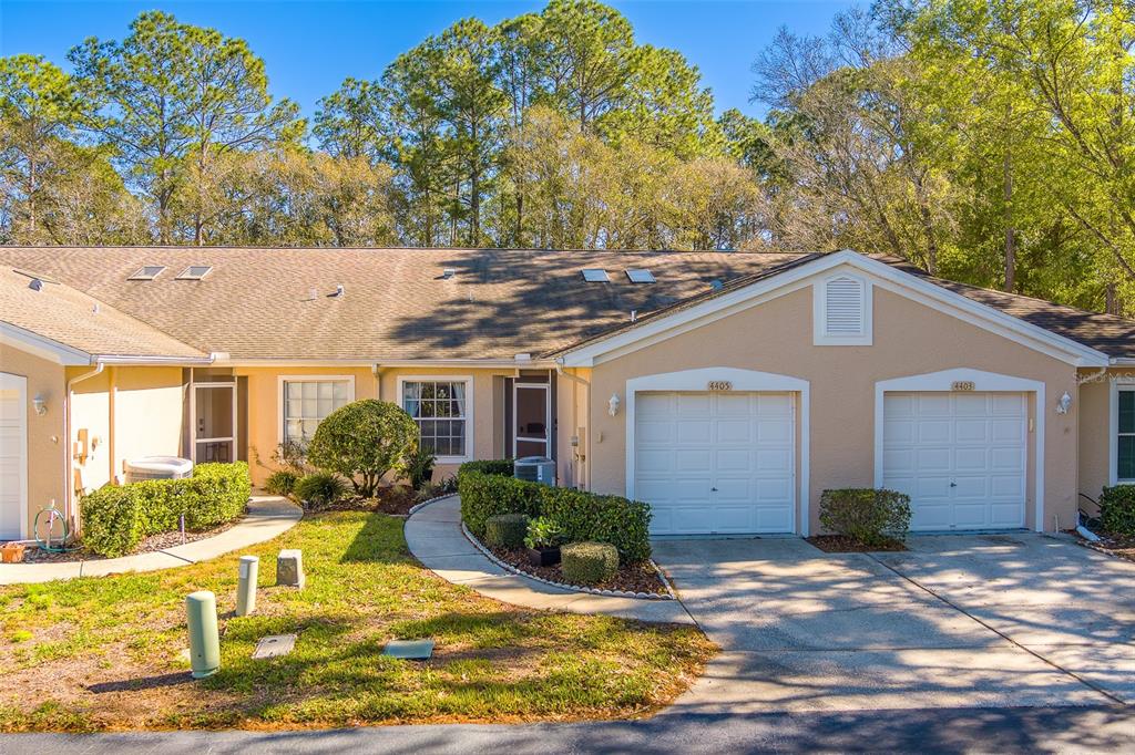 a front view of house with yard having outdoor seating