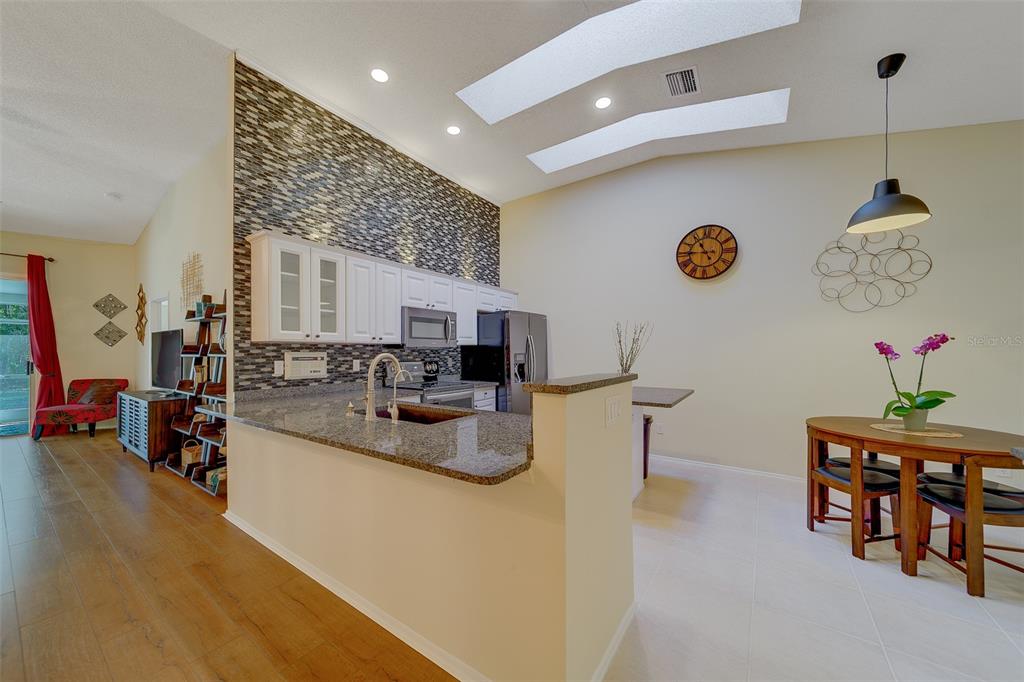 4405 Connery Court Palm Harbor, FL 34685 - Photo 11 of 51 a living room with furniture and a table