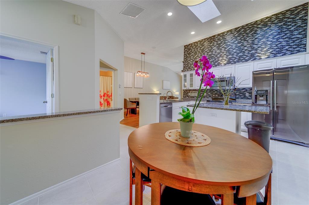 4405 Connery Court Palm Harbor, FL 34685 - Photo 16 of 51 a view of a dining room with furniture