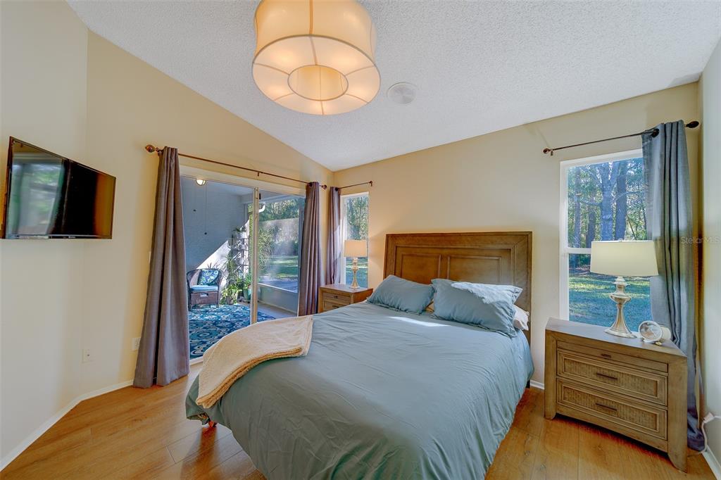 4405 Connery Court Palm Harbor, FL 34685 - Photo 20 of 51 a bedroom with a bed and a large window