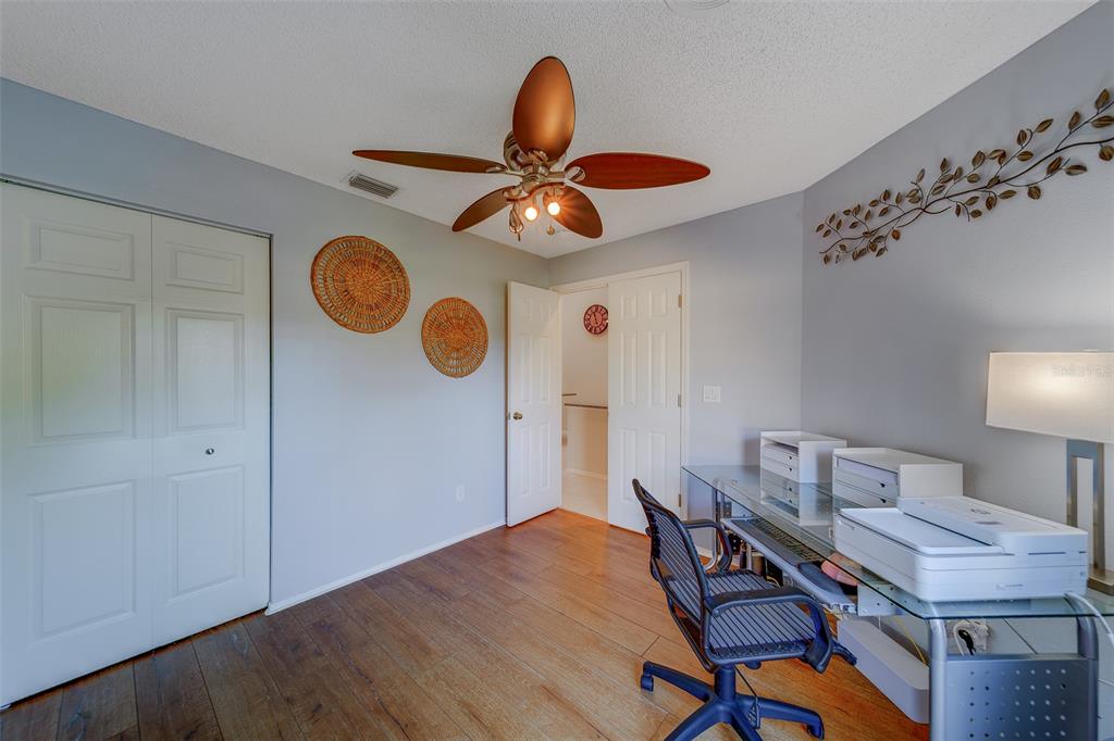 4405 Connery Court Palm Harbor, FL 34685 - Photo 30 of 51 a workspace with furniture and chandelier