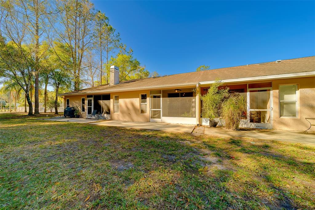 4405 Connery Court Palm Harbor, FL 34685 - Photo 38 of 51 a front view of a building with a garden