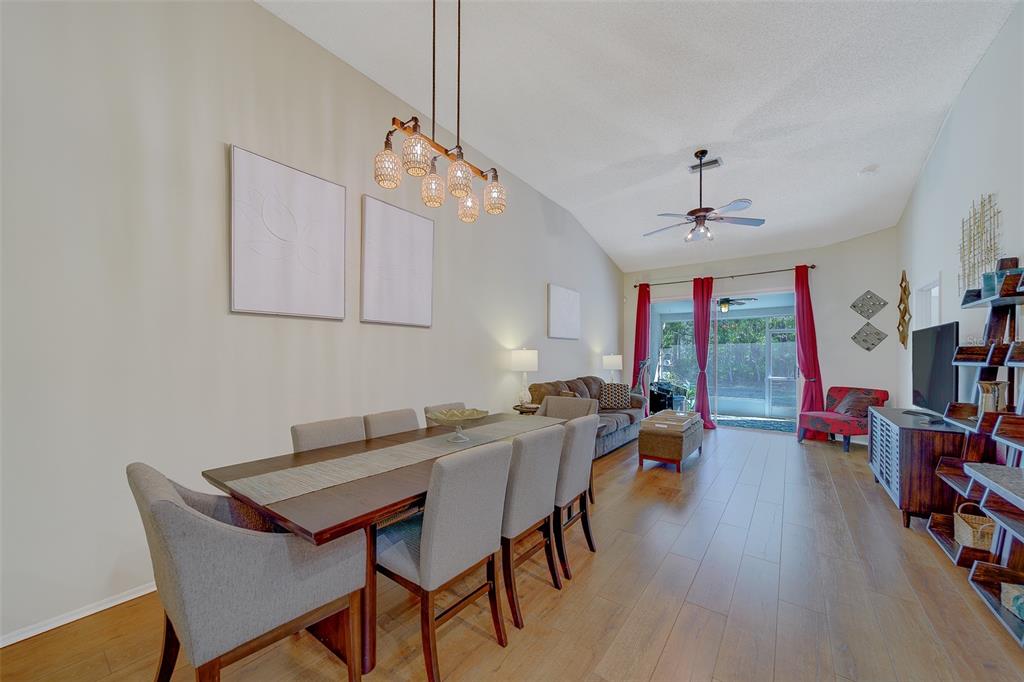 4405 Connery Court Palm Harbor, FL 34685 - Photo 4 of 51 a view of a dining room with furniture window and wooden floor