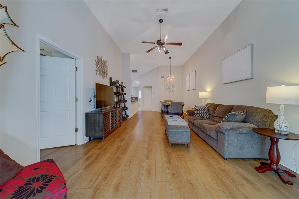 4405 Connery Court Palm Harbor, FL 34685 - Photo 6 of 51 a living room with furniture and a wooden floor