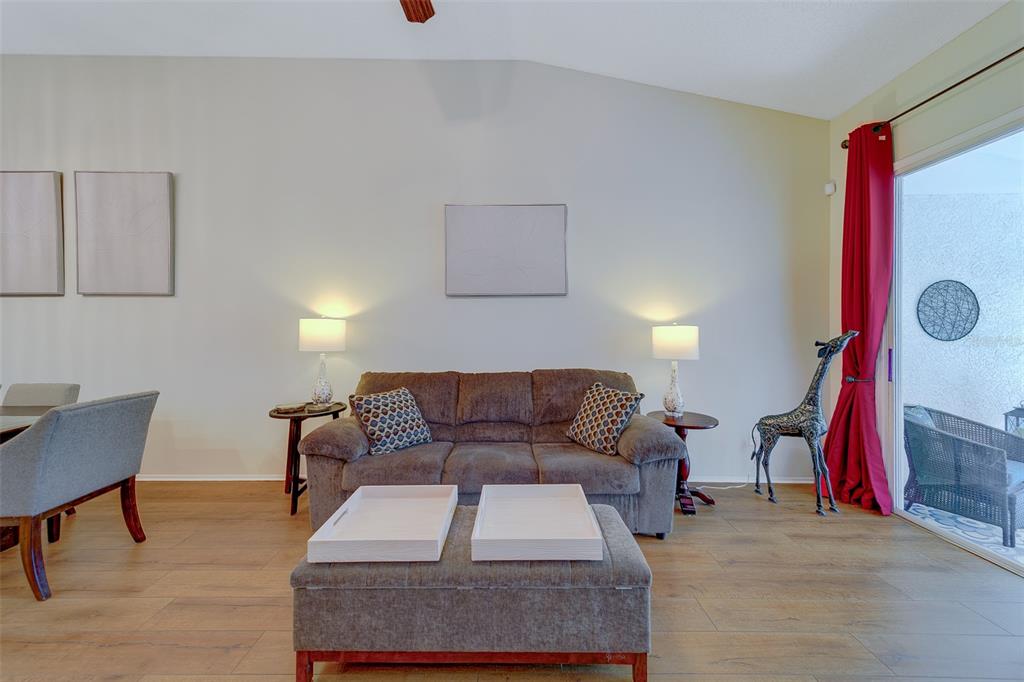 4405 Connery Court Palm Harbor, FL 34685 - Photo 8 of 51 a living room with furniture and a wooden floor
