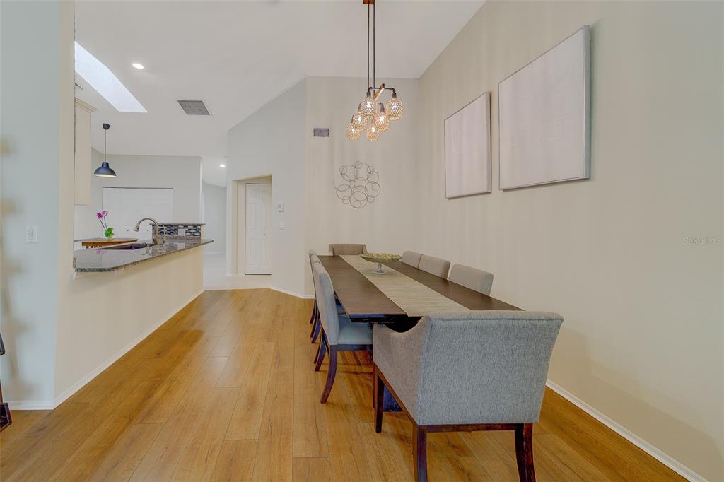 4405 Connery Court Palm Harbor, FL 34685 - Photo 10 of 51 a view of a workspace with furniture and wooden floor