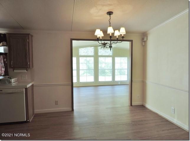 5210 Carr Road Wilson, NC 27893 - Photo 11 of 36 10 Dining Area Into Sunroom