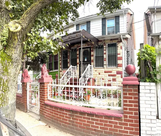 a view of a building with glass windows and table and chairs