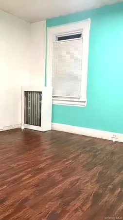 a bedroom with a bed and a cabinets