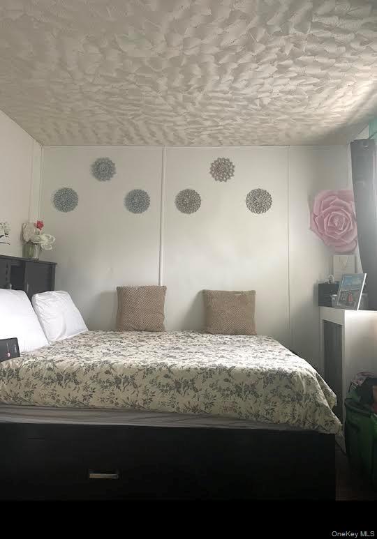 175-08 93rd Avenue Queens, NY 11433 - Photo 16 of 17 a bedroom with a bed and a cabinets