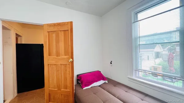 a kitchen with stainless steel appliances granite countertop a stove a sink and a refrigerator with wooden floor