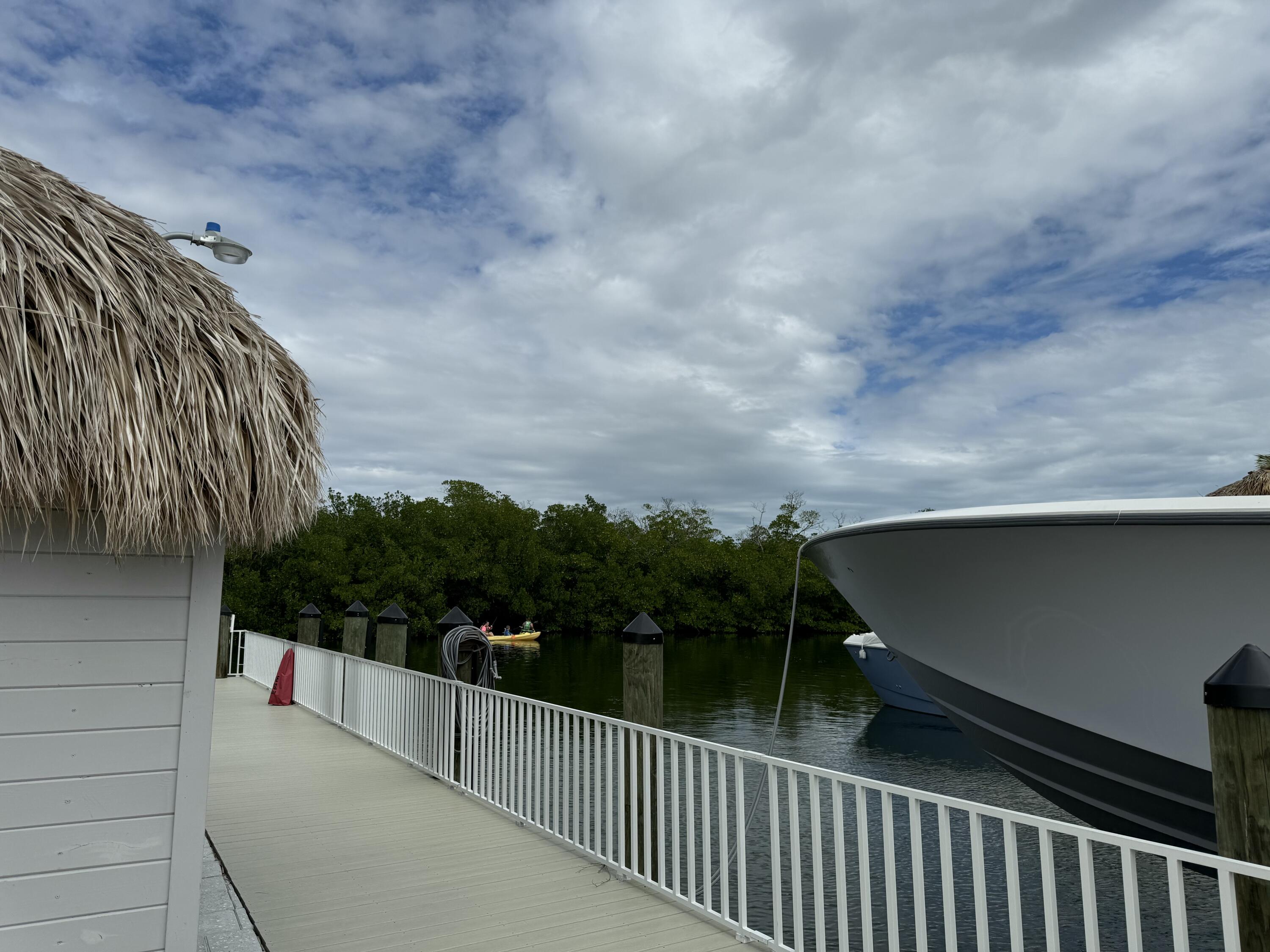 a balcony with view of trees in the background
