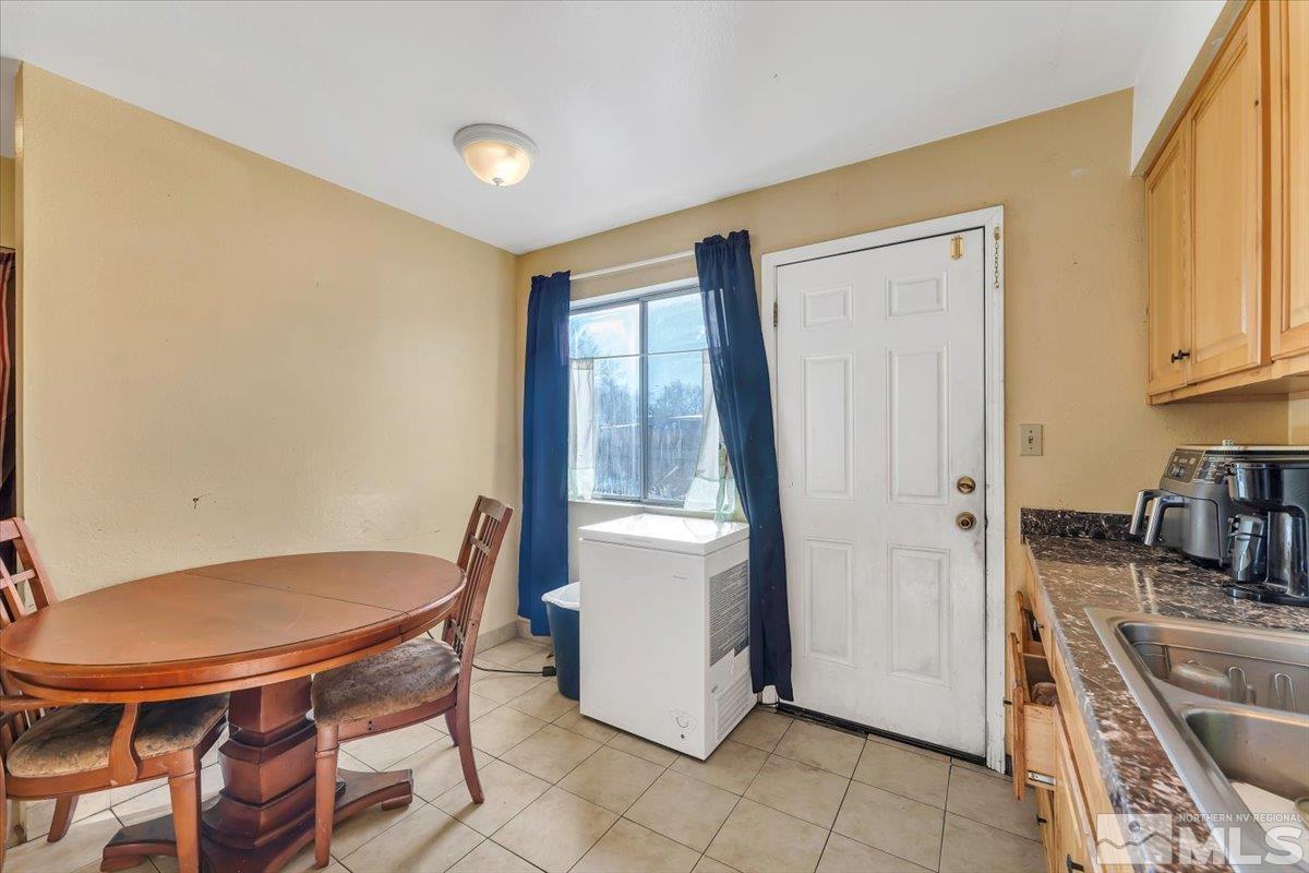 1402 East 9th Street, Unit 11 Reno, NV 89512 - Photo 15 of 25 a view of a kitchen with furniture and a window