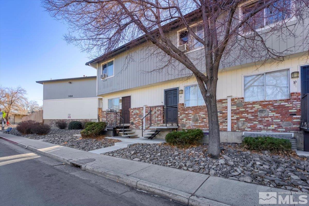 1402 East 9th Street, Unit 11 Reno, NV 89512 - Photo 3 of 25 a front view of a house with garden