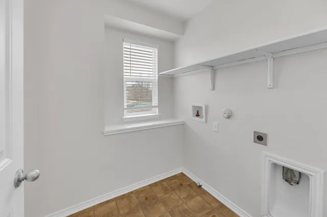 a view of a room that has a window in it