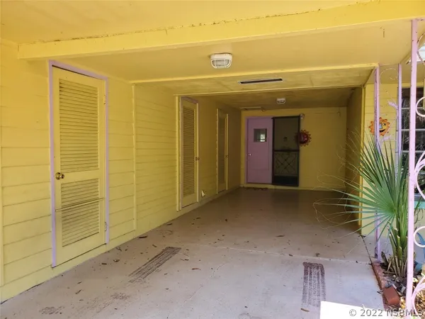 a view of a room with wooden walls