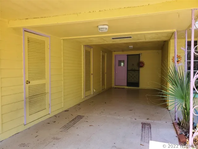 a view of a room with wooden walls