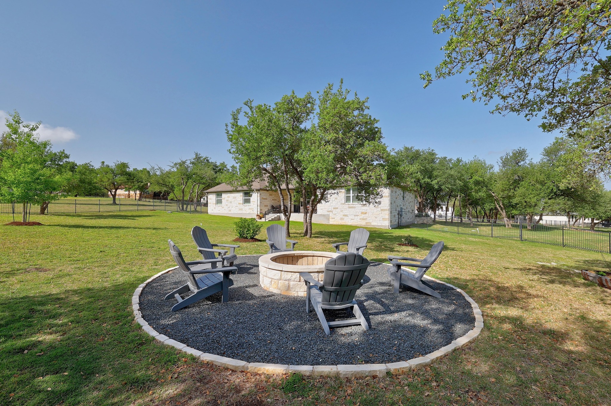 105 Graystone Lane Georgetown, TX 78633 - Photo 30 of 32 Fenced backyard featuring a patio area and an outdoor fire pit