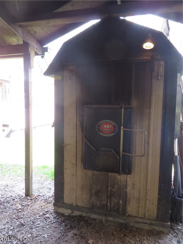 15335 Moseley Road Madison, OH 44057 - Photo 26 of 34 Wood burning Furnace or Propane heat serves entire home.