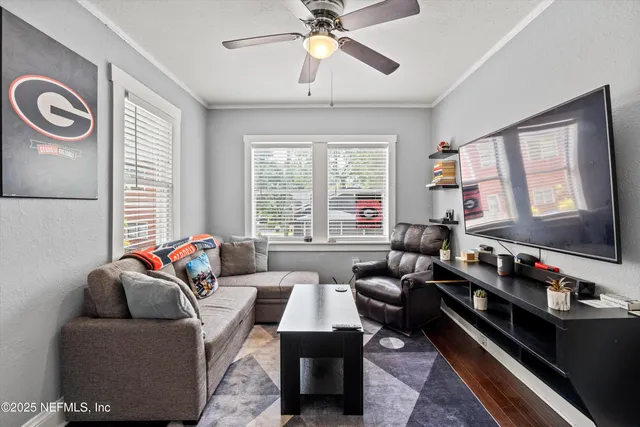 a living room with furniture and a flat screen tv