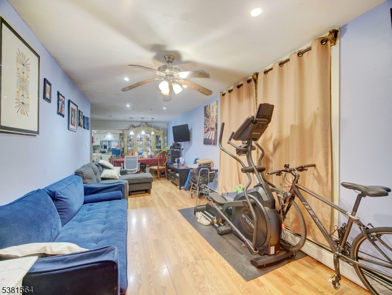 411 Monastery Place Union City, NJ 07087 - Photo 2 of 20 a view of a livingroom with furniture and a ceiling fan