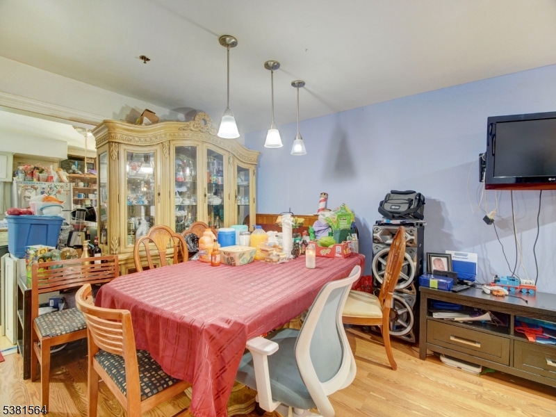 411 Monastery Place Union City, NJ 07087 - Photo 3 of 20 a view of a dining room with furniture