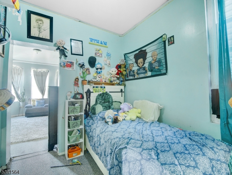 411 Monastery Place Union City, NJ 07087 - Photo 6 of 20 a bedroom with a bed and a window