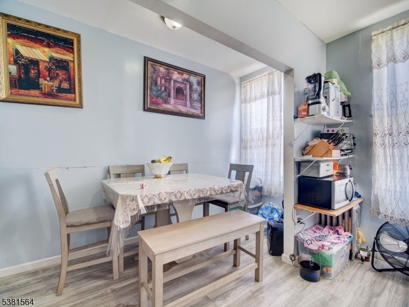 411 Monastery Place Union City, NJ 07087 - Photo 8 of 20 a dining room with furniture and wooden floor