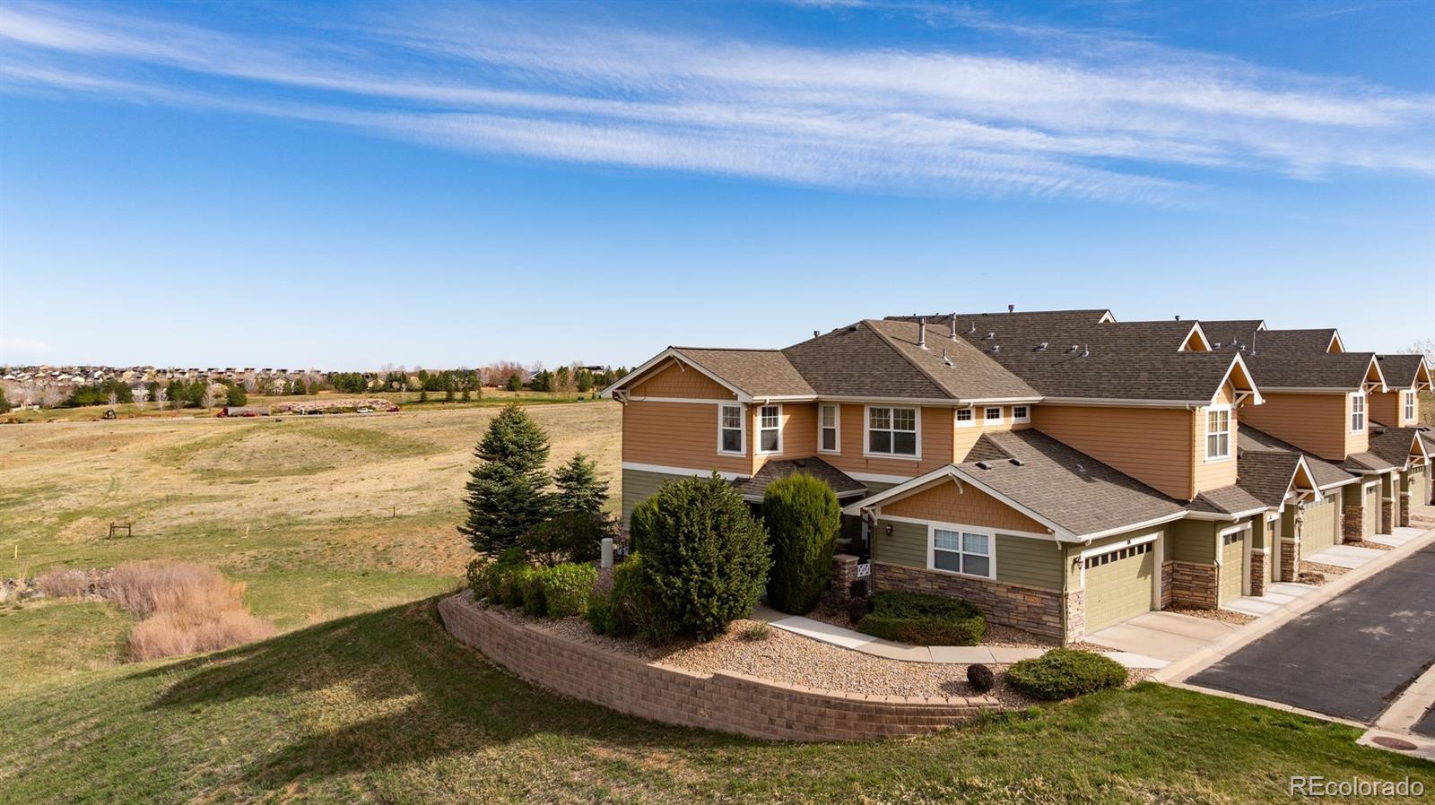 aerial view of a house with a yard