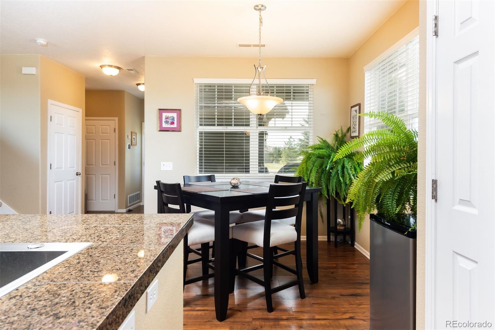 3661 South Perth Circle, Unit 6101 Aurora, CO 80013 - Photo 15 of 48 a view of a dining room with furniture and window