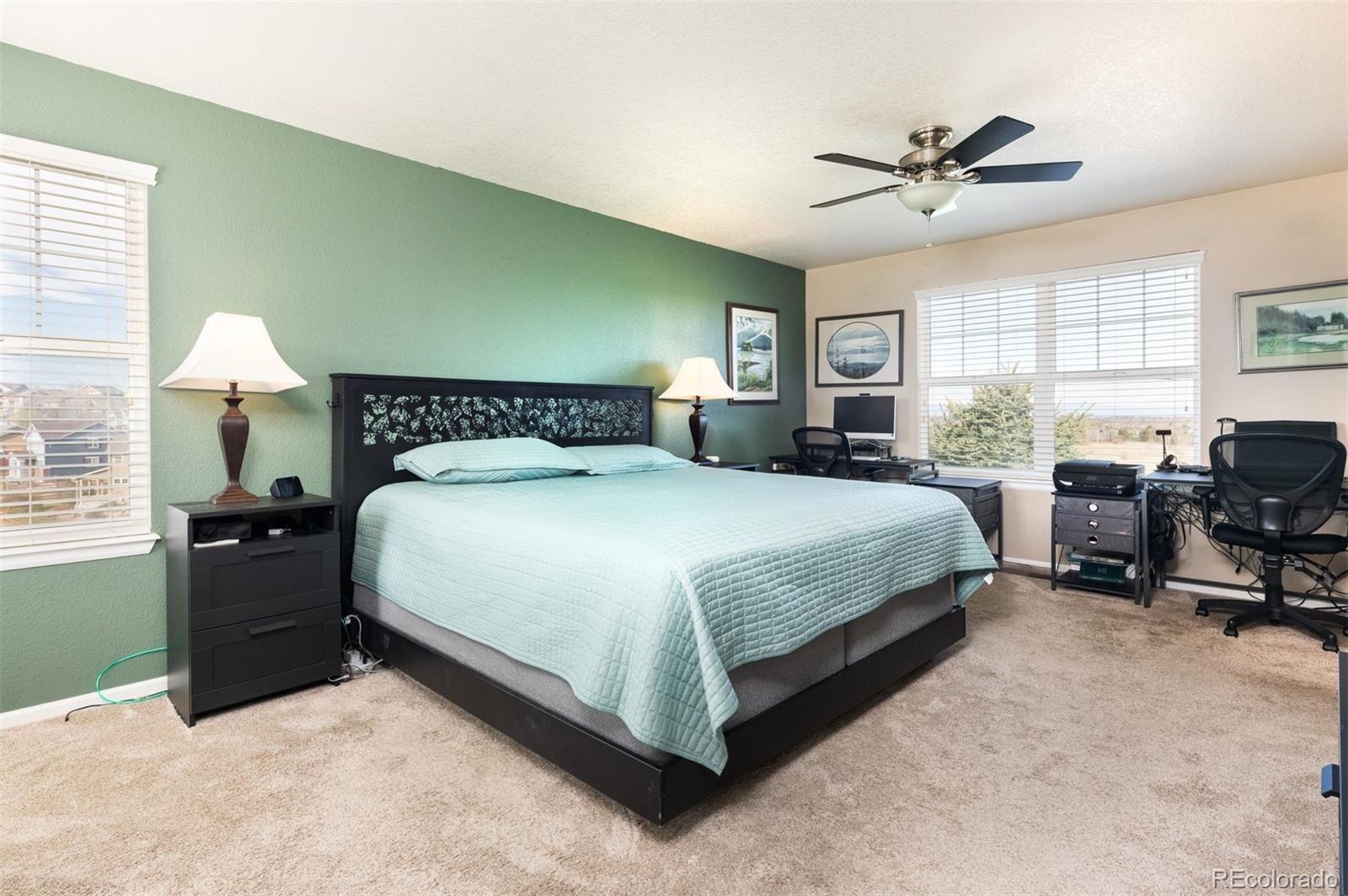 3661 South Perth Circle, Unit 6101 Aurora, CO 80013 - Photo 25 of 48 a bedroom with a bed and furniture