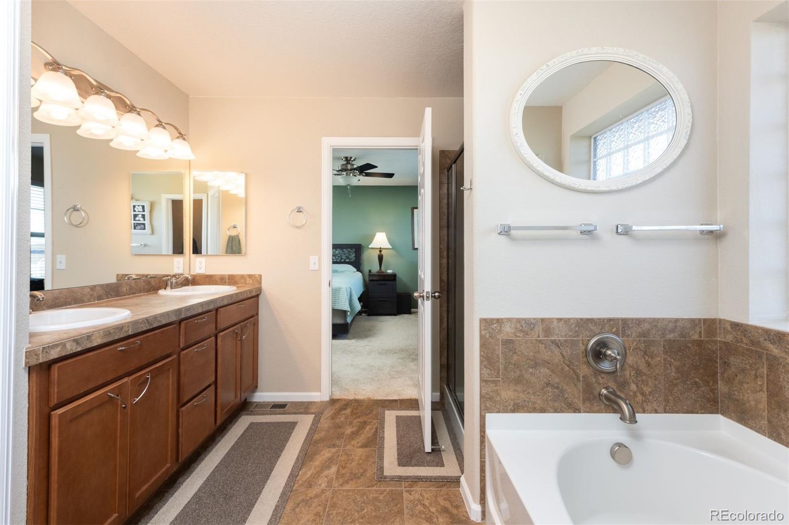 3661 South Perth Circle, Unit 6101 Aurora, CO 80013 - Photo 28 of 48 a spacious bathroom with a bathtub and a sink