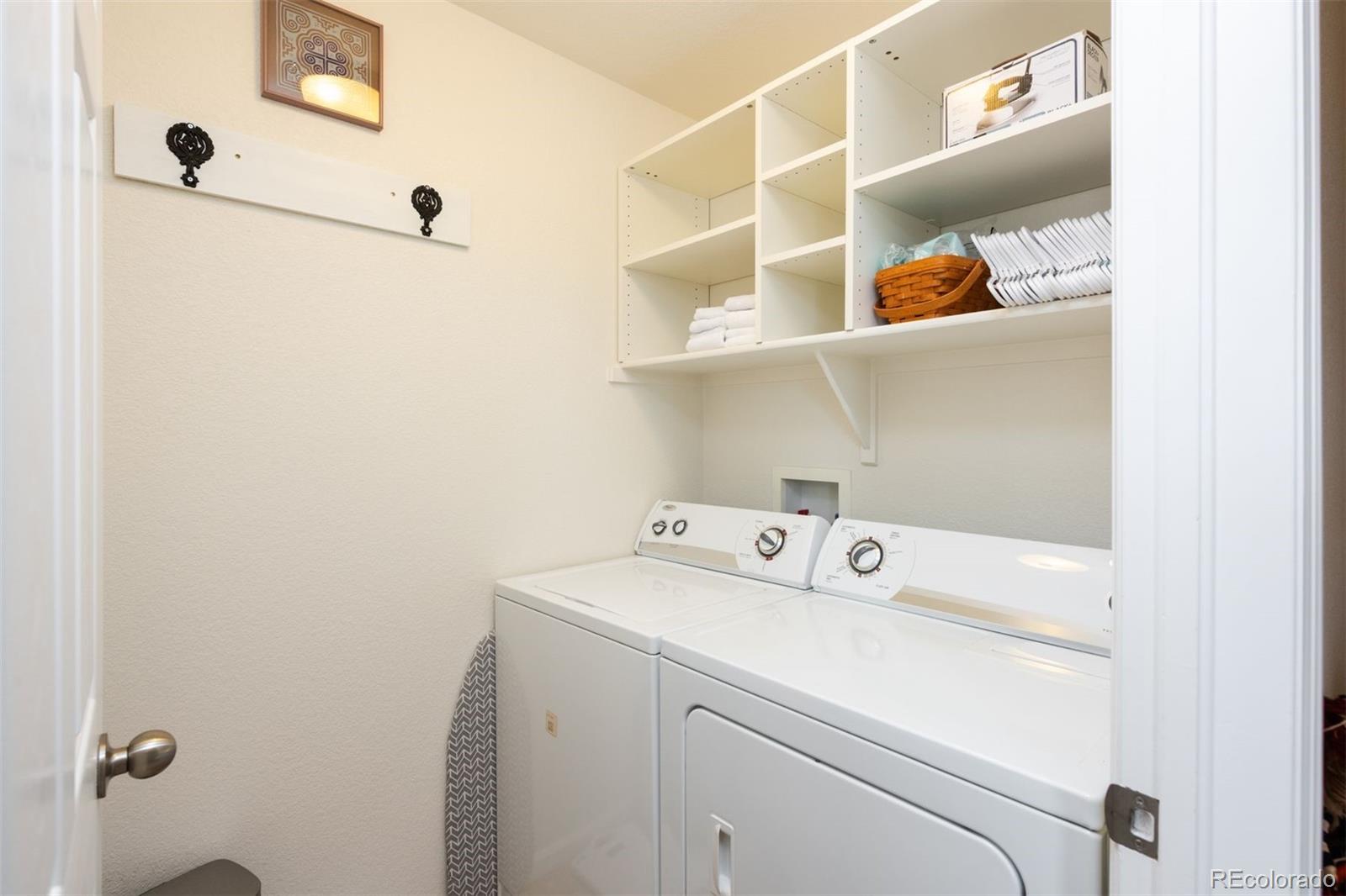 3661 South Perth Circle, Unit 6101 Aurora, CO 80013 - Photo 38 of 48 a utility room with dryer and washer