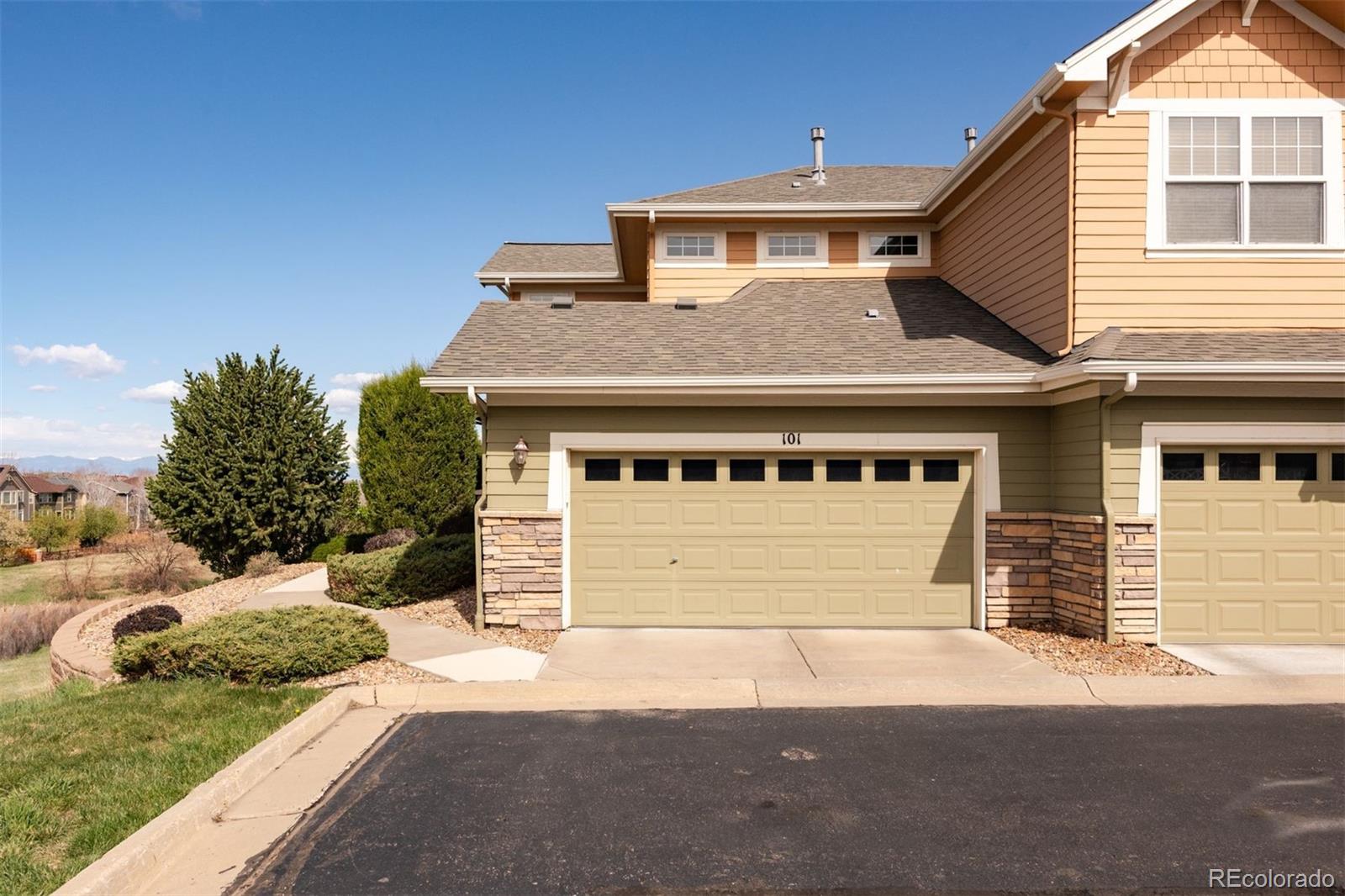 3661 South Perth Circle, Unit 6101 Aurora, CO 80013 - Photo 40 of 48 a front view of a house with a yard