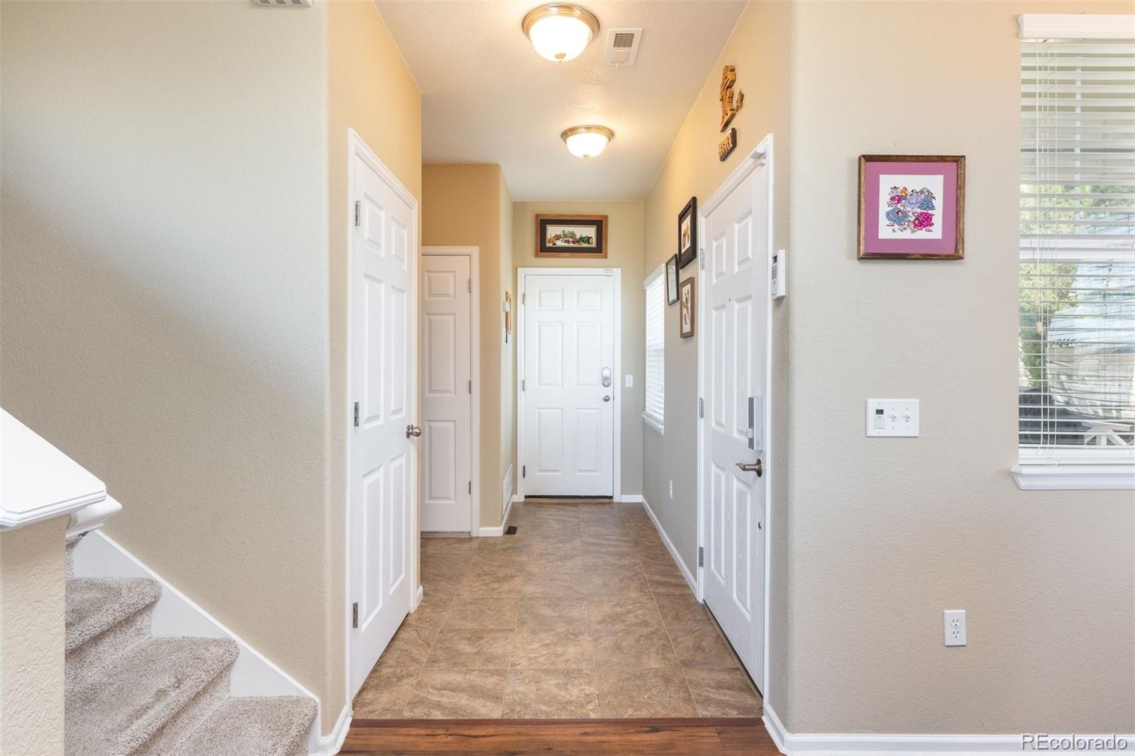 3661 South Perth Circle, Unit 6101 Aurora, CO 80013 - Photo 7 of 48 a view of a hallway with a elevator